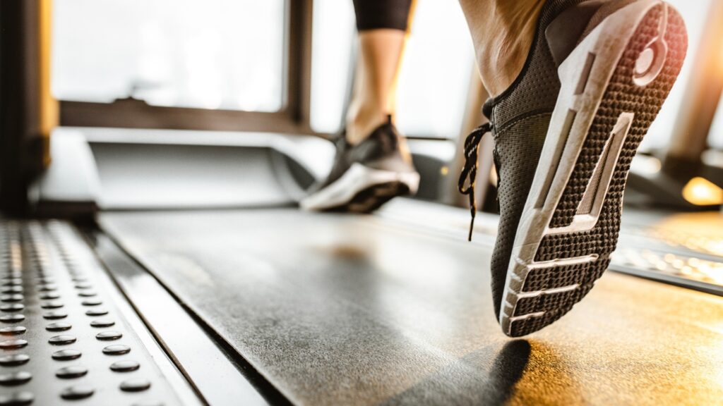 close up of unrecognizable athlete running on a treadmill in a gym picture id1154771778